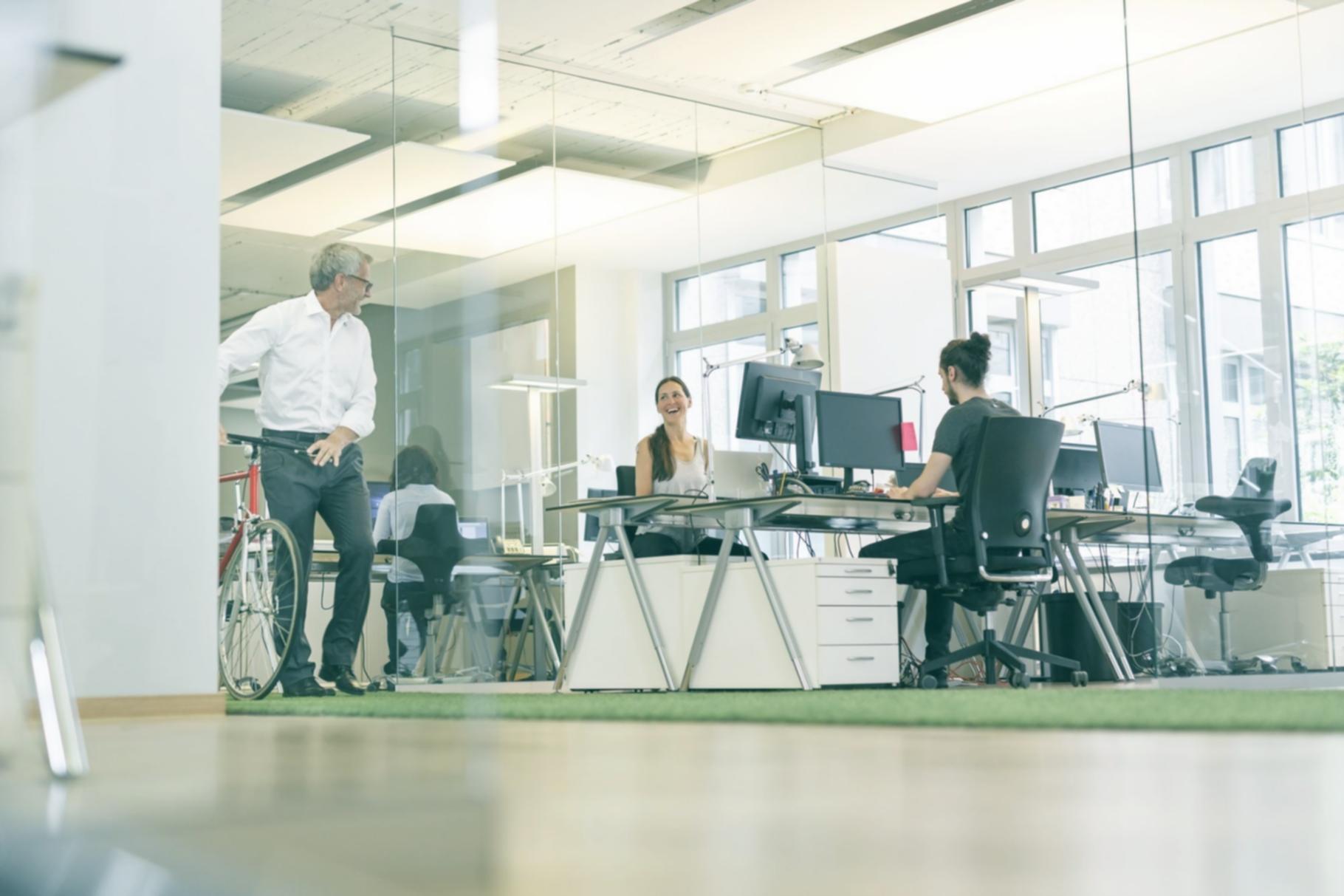 Close-up of manuscript pages with handwritten revision notes and structural annotations