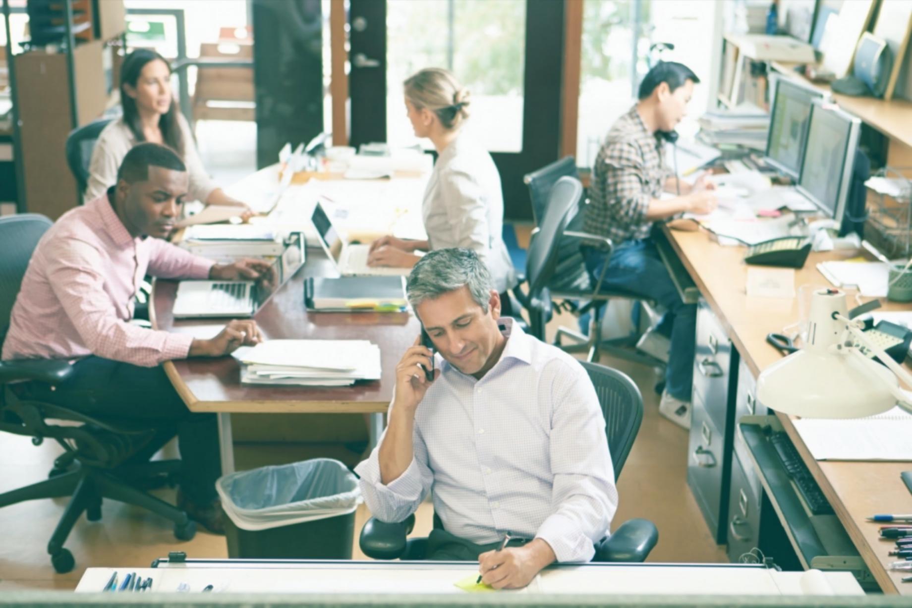 Writer reviewing narrative structure notes with highlighted manuscript